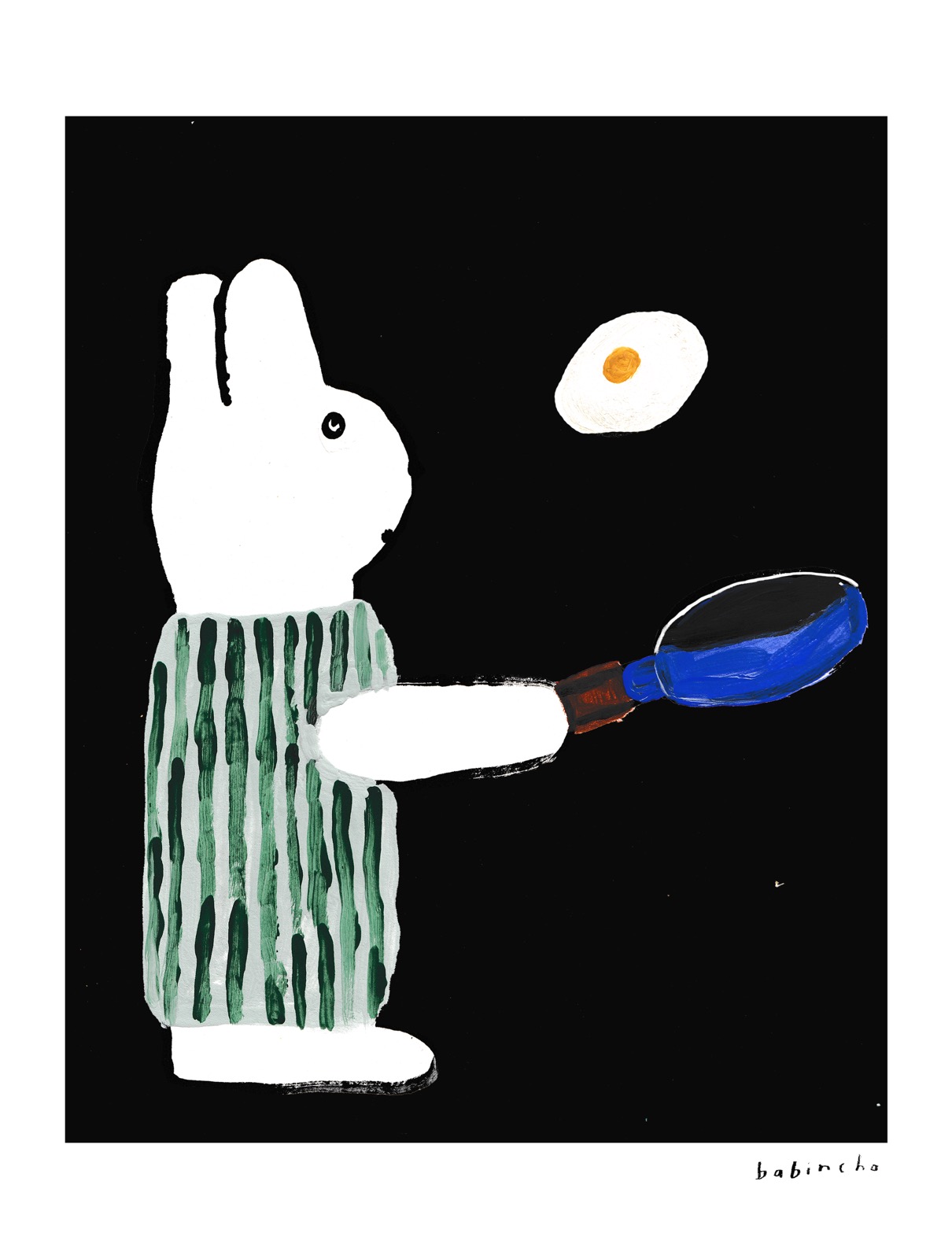 Nisa the bunny cooking an egg in a frying pan