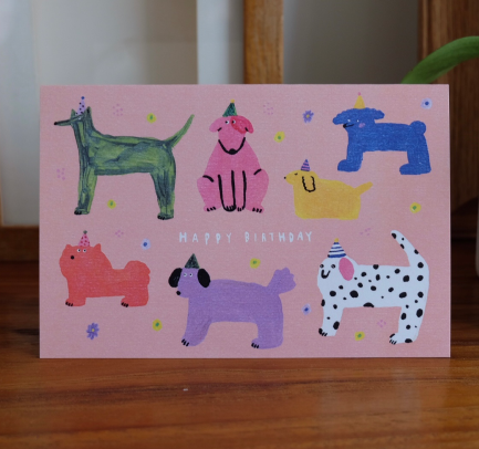 A Babincho animal birthday card displayed on a wooden shelf