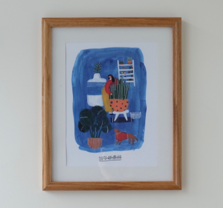 A framed blue Babincho art print displayed on a wall